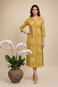 Model wearing a mustard yellow striped printed collared kurta dress with three-quarter sleeves
